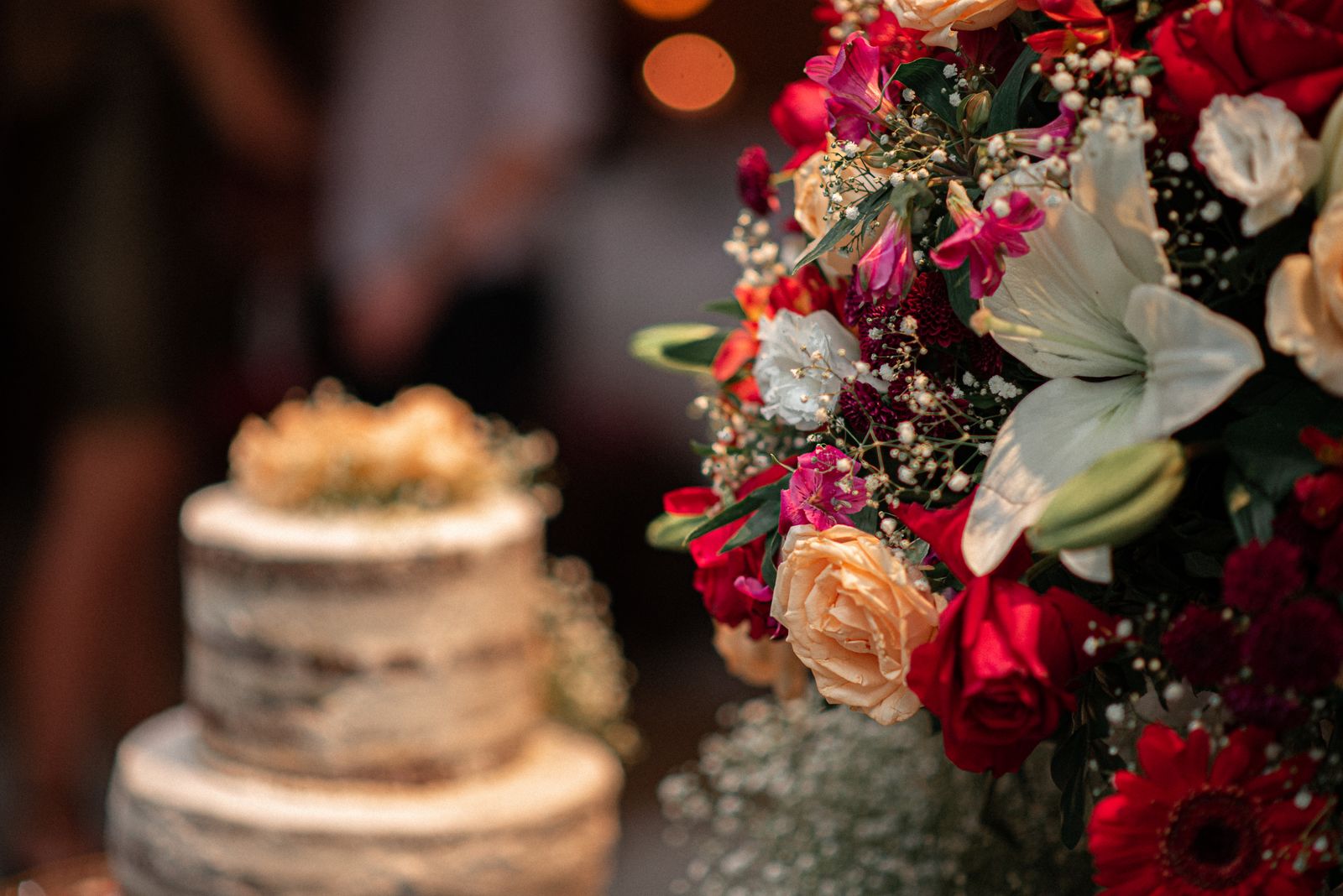 Celebration cake surrounded by flowers