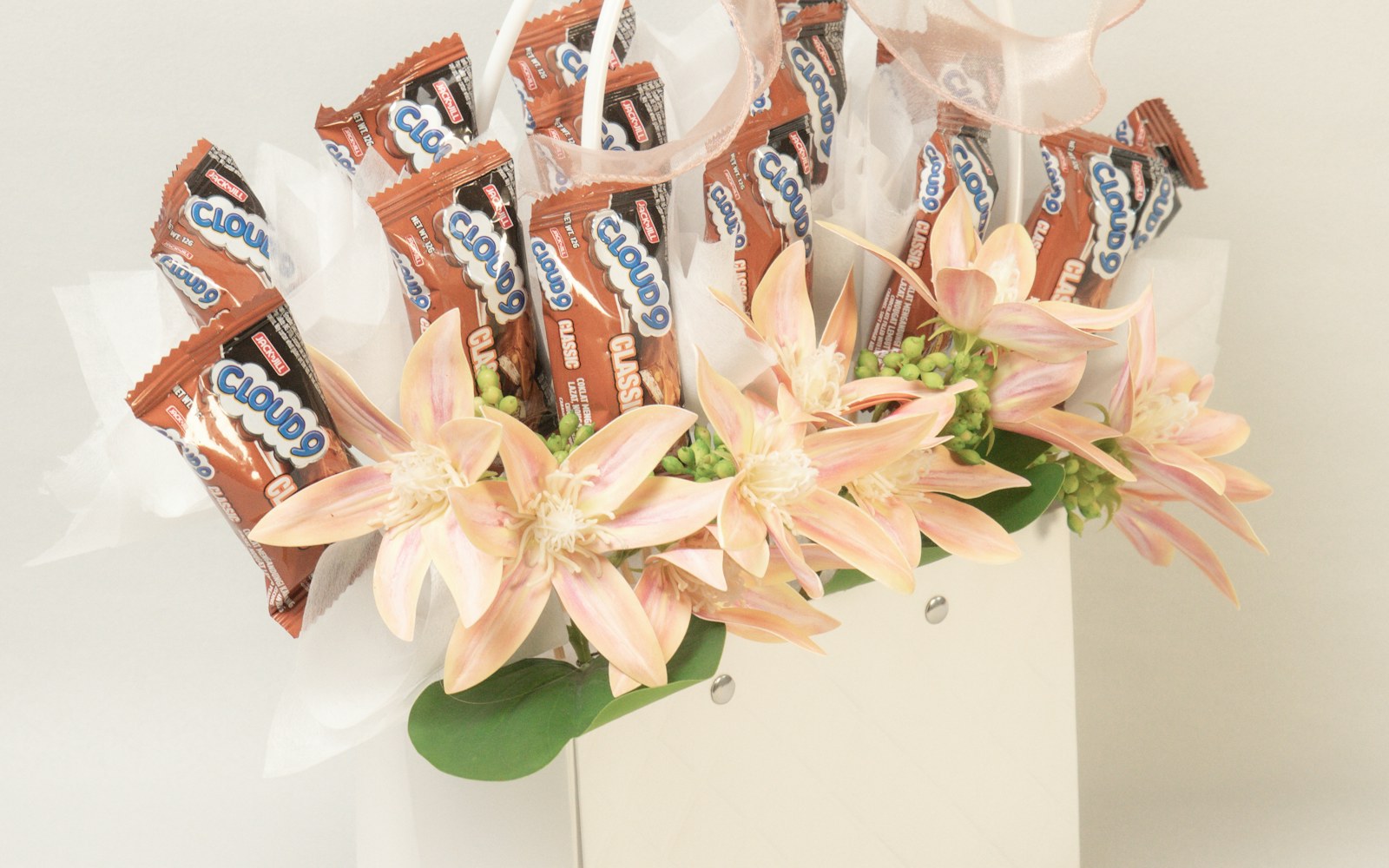 Chocolate and flowers arranged as a curated gift